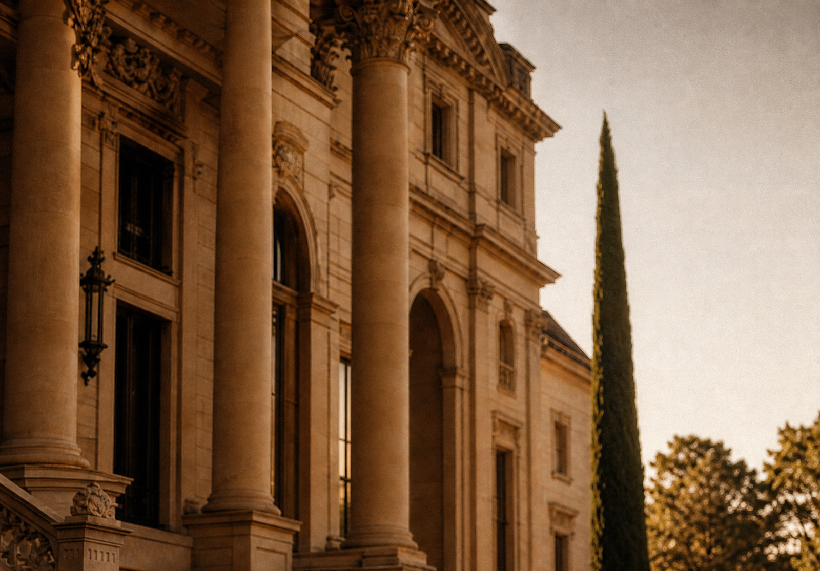 An anonymous architectural crop from a delivered brand creative showing warm historic stonework